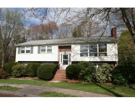 42 Hewitt Circle Needham, MA 02494 - Photo 1 of 10 a front view of a house with a yard