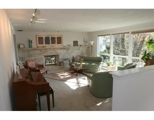 42 Hewitt Circle Needham, MA 02494 - Photo 5 of 10 a living room with fireplace furniture and a large window