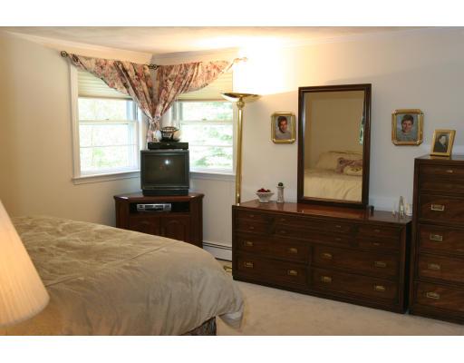 42 Hewitt Circle Needham, MA 02494 - Photo 7 of 10 a bedroom with a bed and a television