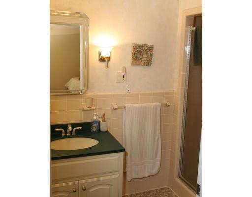 42 Hewitt Circle Needham, MA 02494 - Photo 10 of 10 a bathroom with a granite countertop sink and a mirror