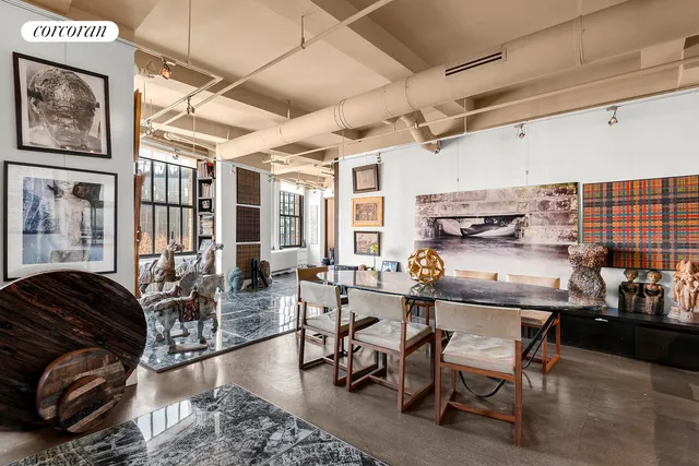 a living room with lots of furniture and a chandelier
