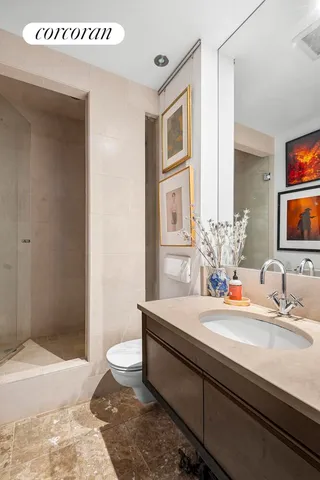 a kitchen with stainless steel appliances granite countertop a sink and a refrigerator