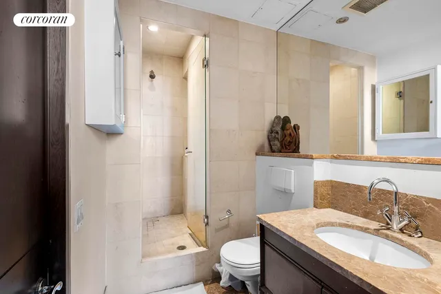 a bedroom with a bed and a television