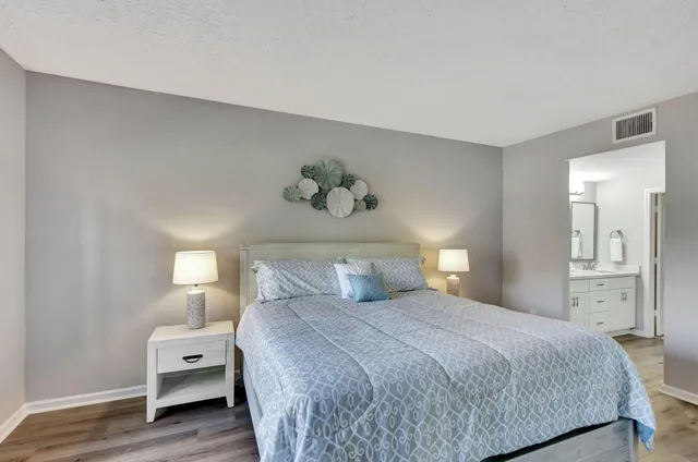 a bathroom with a double vanity sink mirror and shower