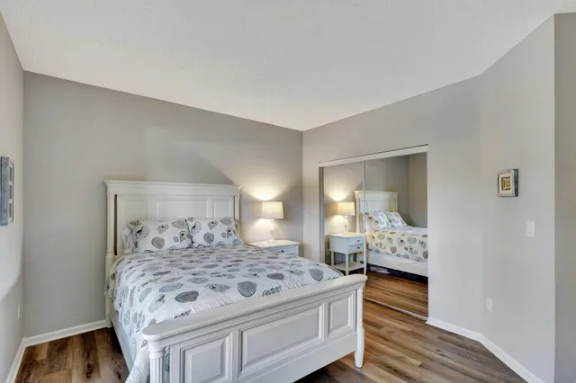 a bedroom with a bed and a dresser