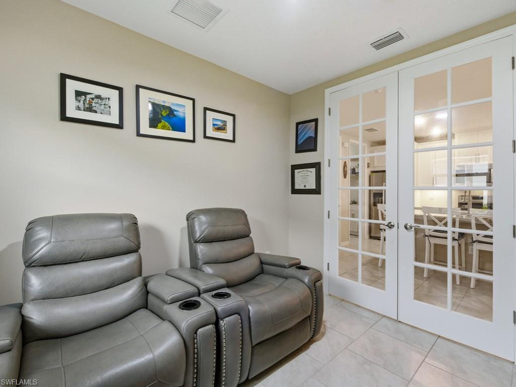 14591 Edgewater Circle Naples, FL 34114 - Photo 13 of 36 Matching tiled den with French doors use as an office or study or just a quiet room