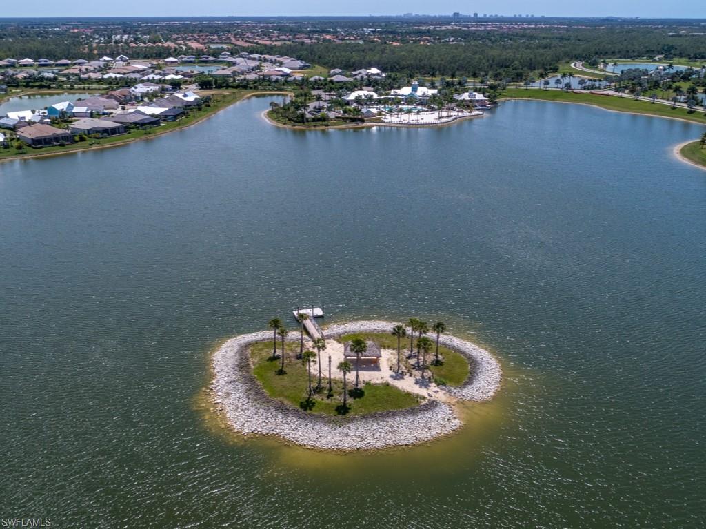 14591 Edgewater Circle Naples, FL 34114 - Photo 25 of 36 Enjoy an electric pontoon boat ride to our middle of the lake private island or enjoy a kayak on the lake