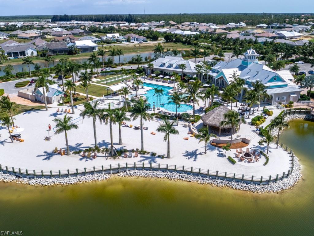 14591 Edgewater Circle Naples, FL 34114 - Photo 27 of 36 Aerial view of beach next to community pool - enjoy a game of beach volleyball or just sit in the sand and enjoy the view!