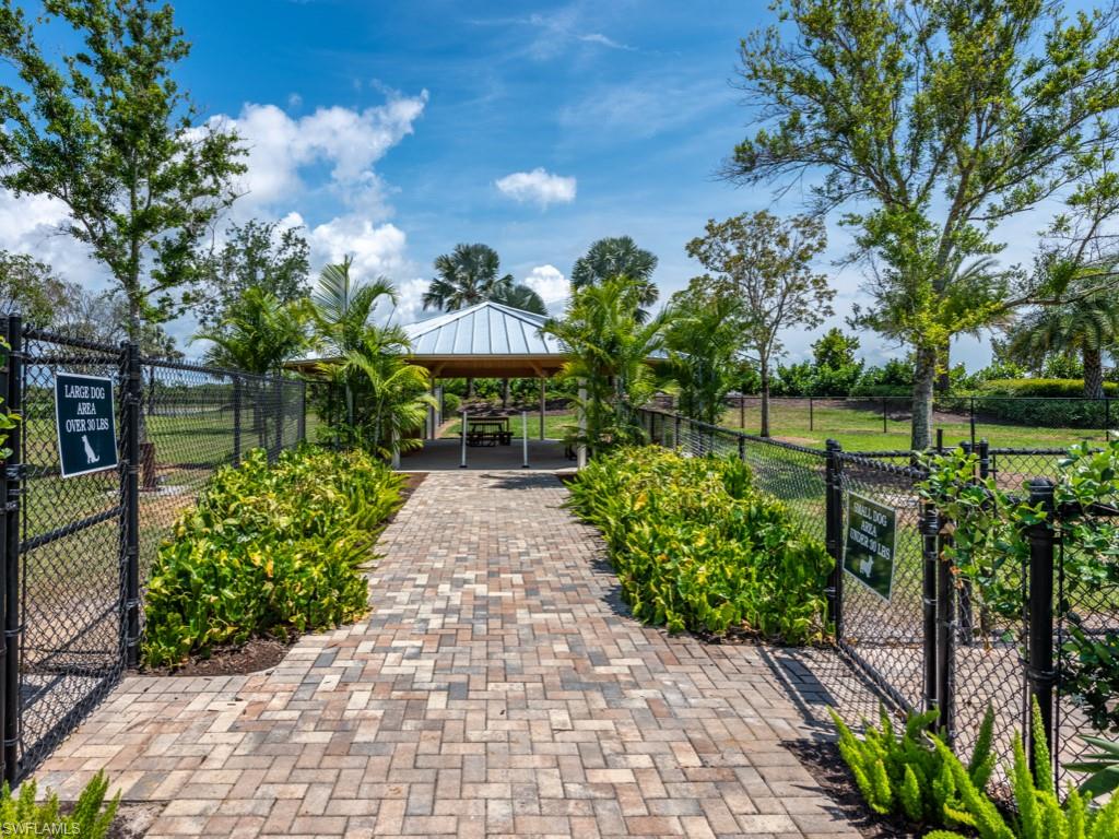 14591 Edgewater Circle Naples, FL 34114 - Photo 30 of 36 View of community two dog parks (large and small dogs) with a gate, a patio area, and a gazebo