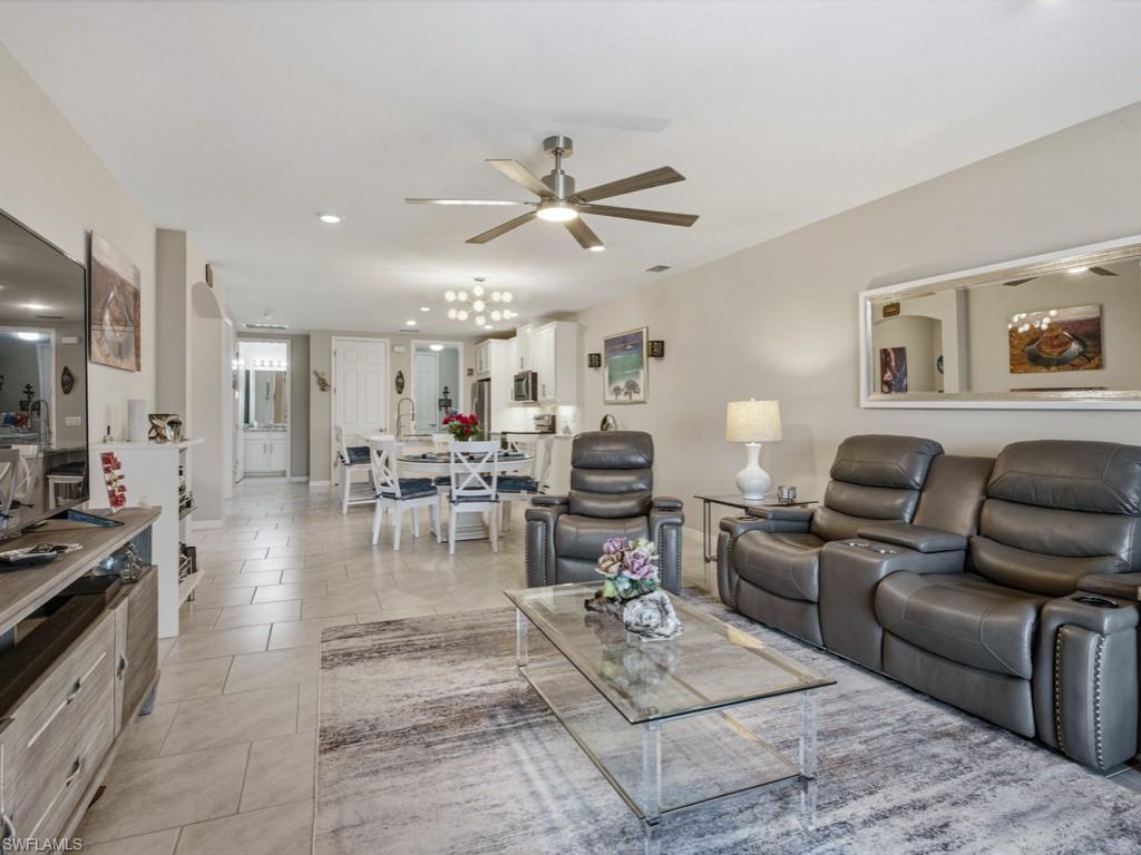 14591 Edgewater Circle Naples, FL 34114 - Photo 6 of 36 Living area with ceiling fan, recessed lighting, and light tile patterned floors