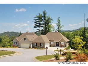 52 Carriage Spring Way Hendersonville, NC 28791 - Photo 1 of 12 a front view of a house with a yard and garage
