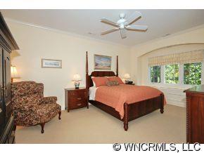 52 Carriage Spring Way Hendersonville, NC 28791 - Photo 6 of 12 a bedroom with a bed window and couch