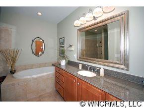 52 Carriage Spring Way Hendersonville, NC 28791 - Photo 7 of 12 a bathroom with a sink mirror and vanity