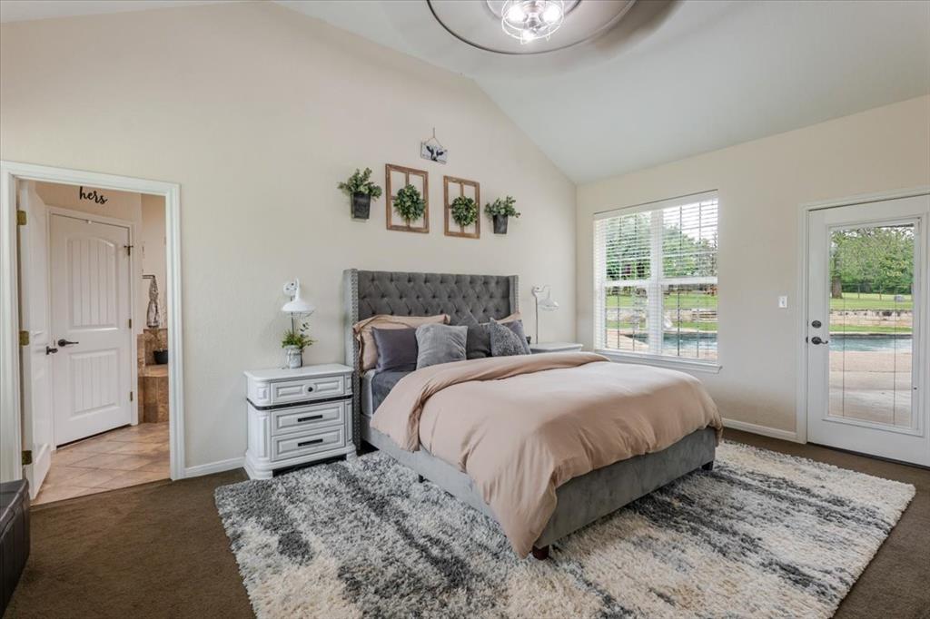 318 East Lone Star Road Poolville, TX 76487 - Photo 8 of 33 a bedroom with a bed and a window