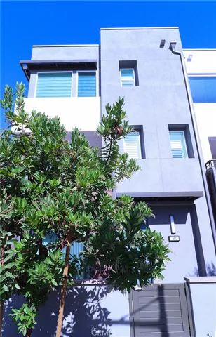 a view of a house with a flower garden