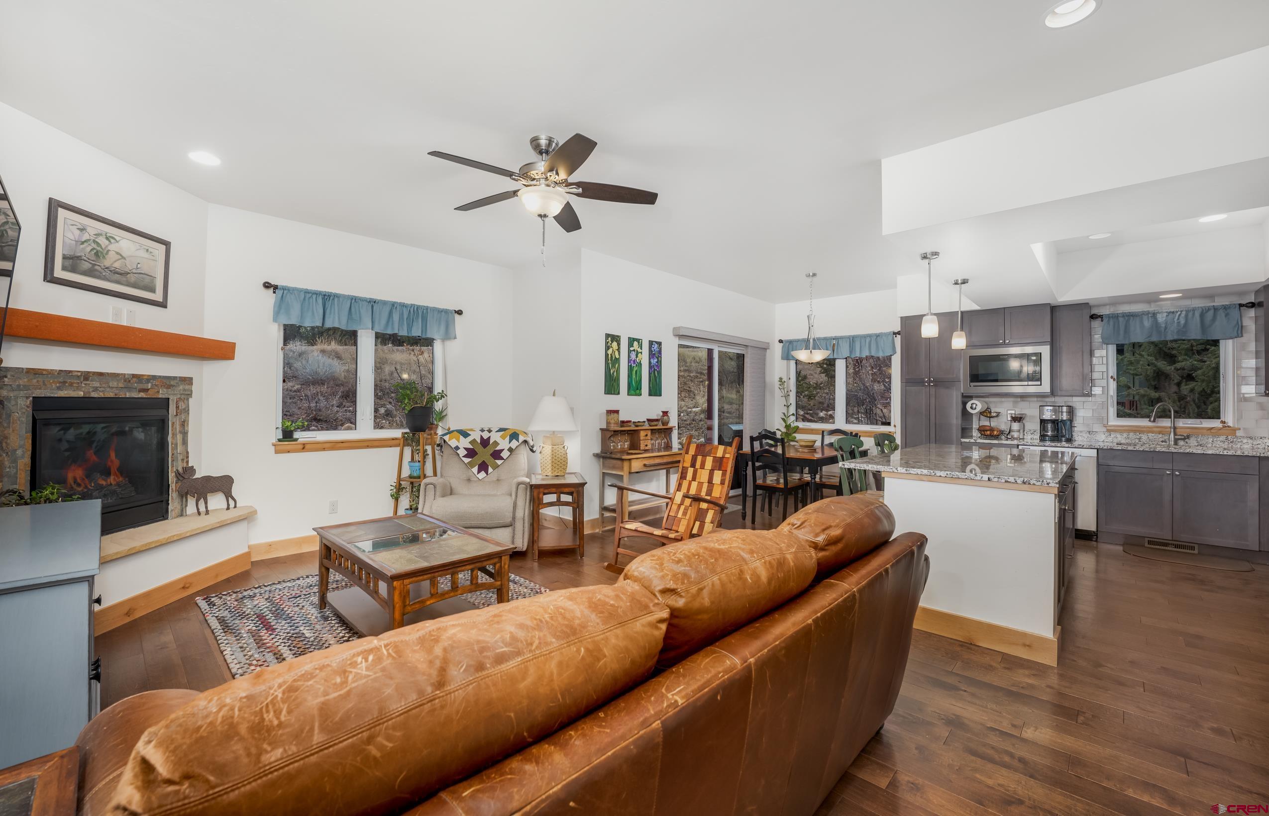 41 Mountain Stream Court Durango, CO 81301 - Photo 16 of 29 a living room with furniture and a fireplace