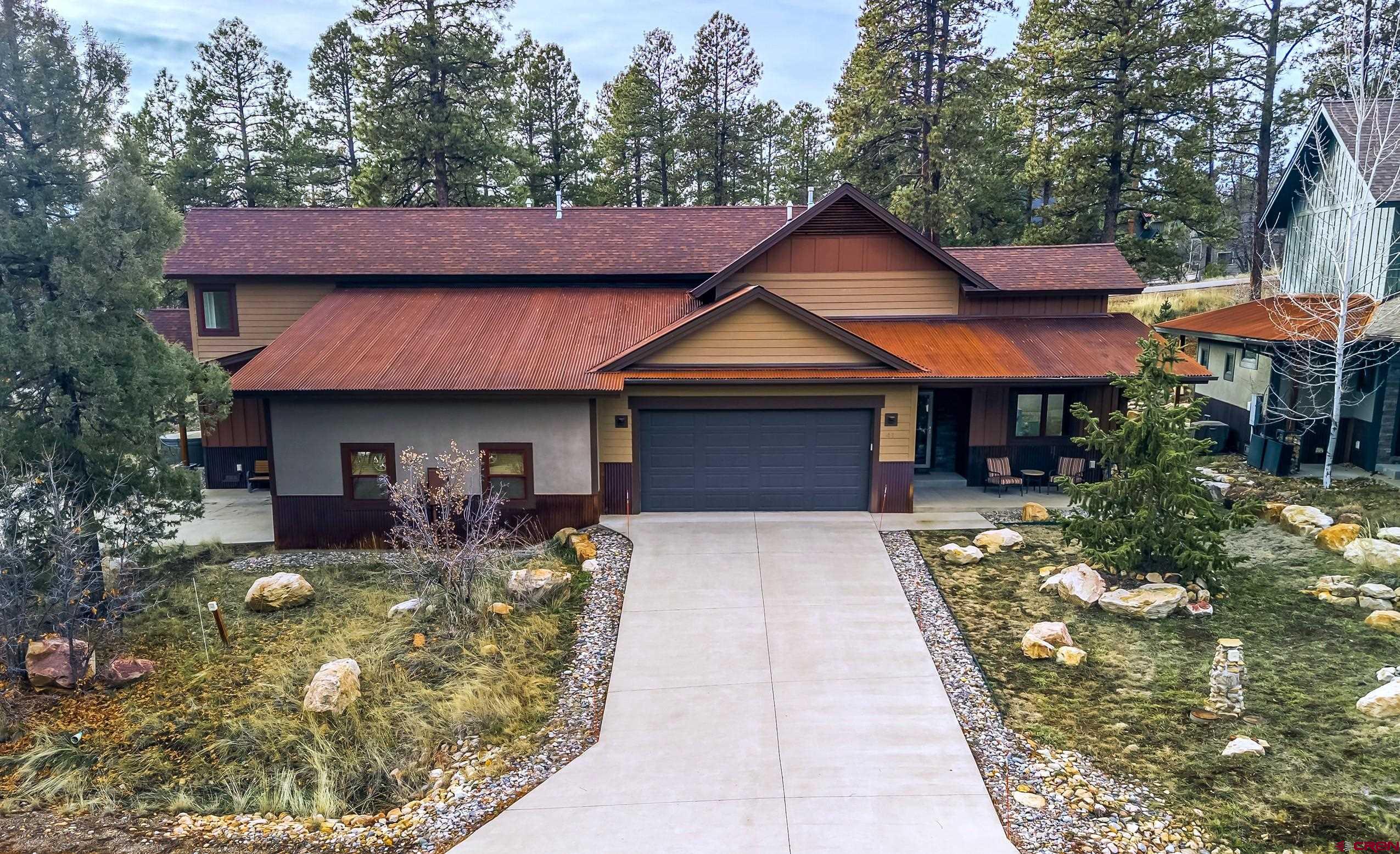41 Mountain Stream Court Durango, CO 81301 - Photo 26 of 29 a front view of a house with garden