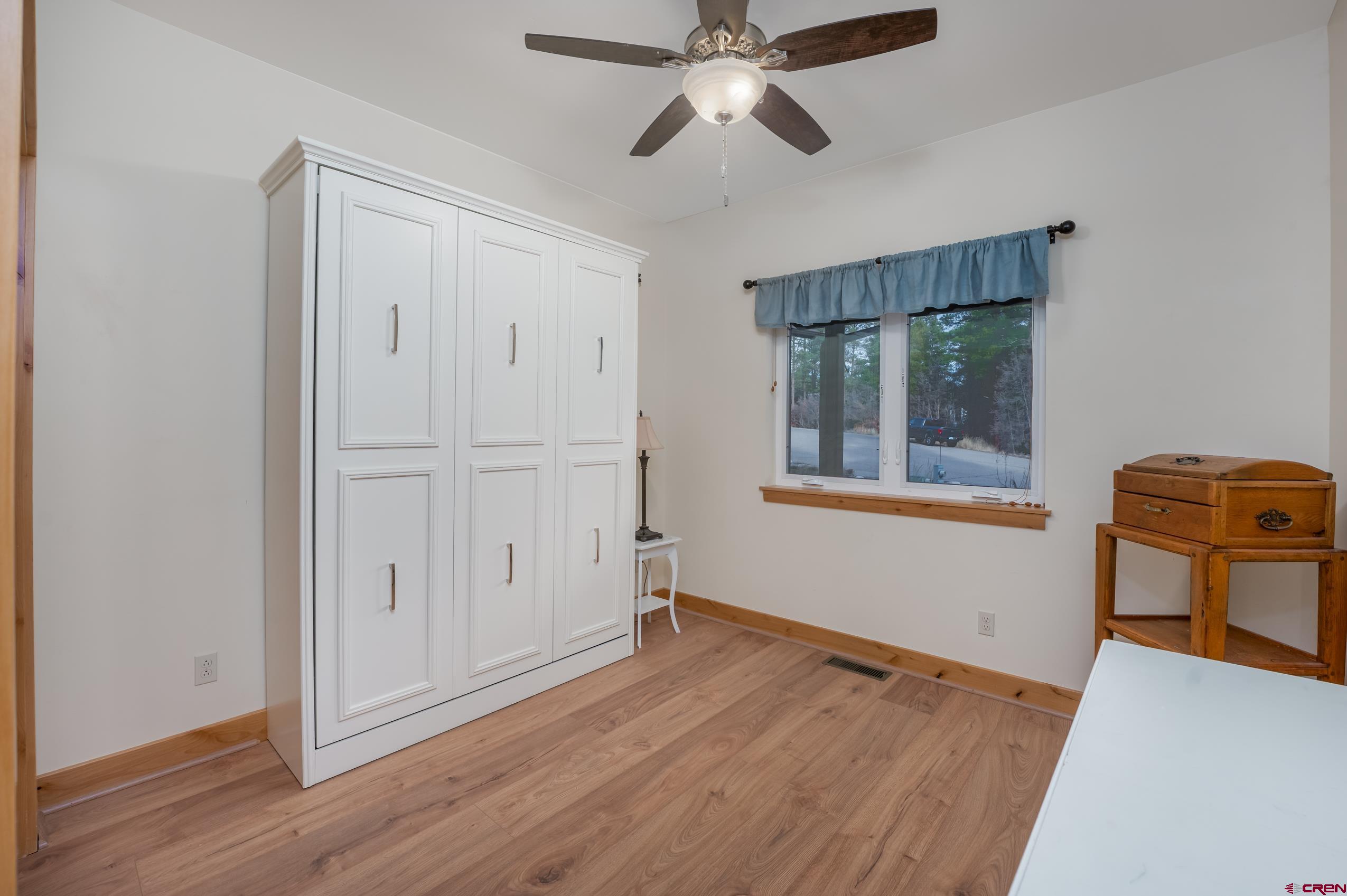 41 Mountain Stream Court Durango, CO 81301 - Photo 5 of 29 a view of empty room with wooden floor and fan