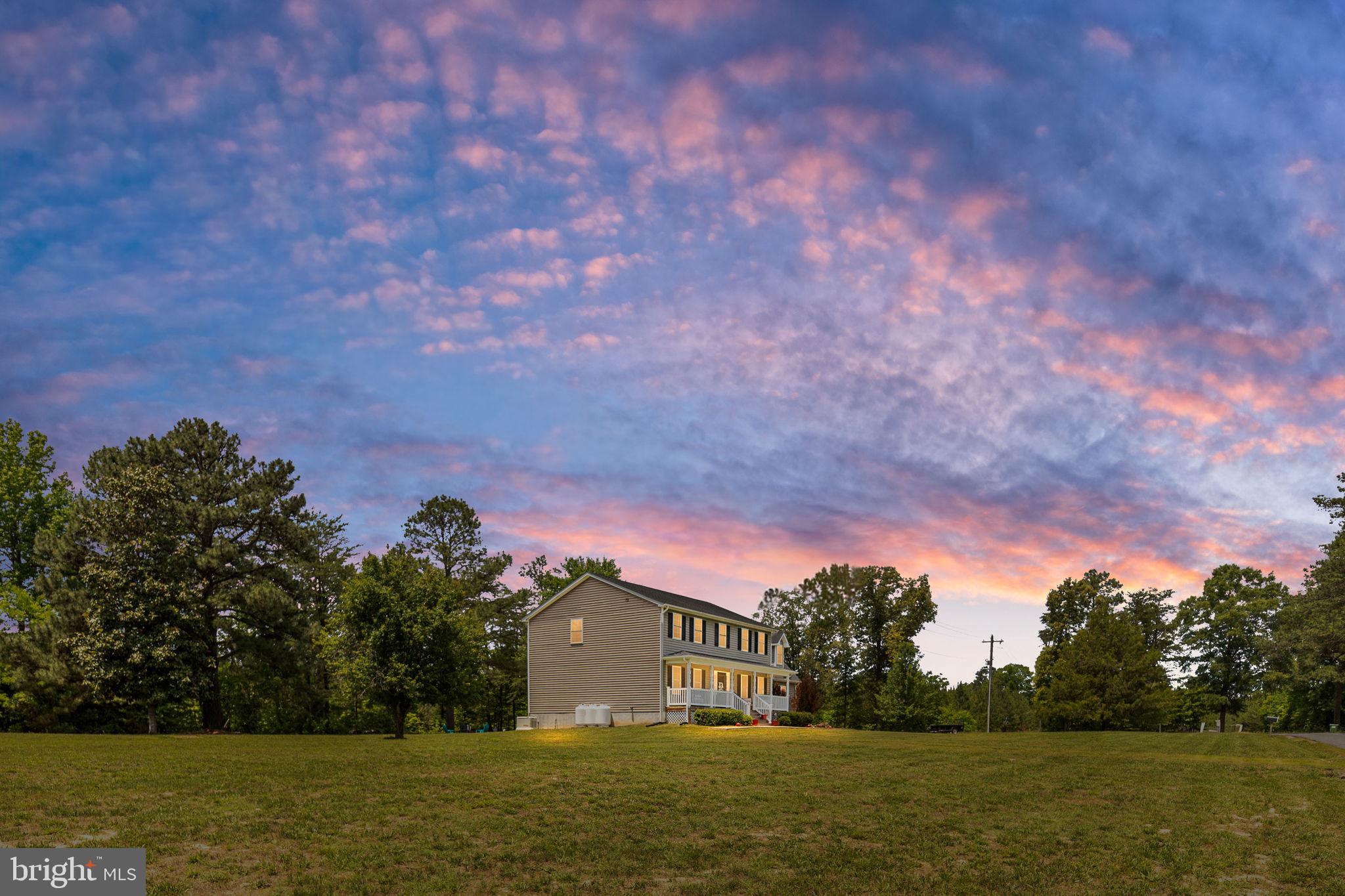 22088 Landora Bridge Road Ruther Glen, VA 22546 - Photo 5 of 122 Charming home under a vibrant sky.
