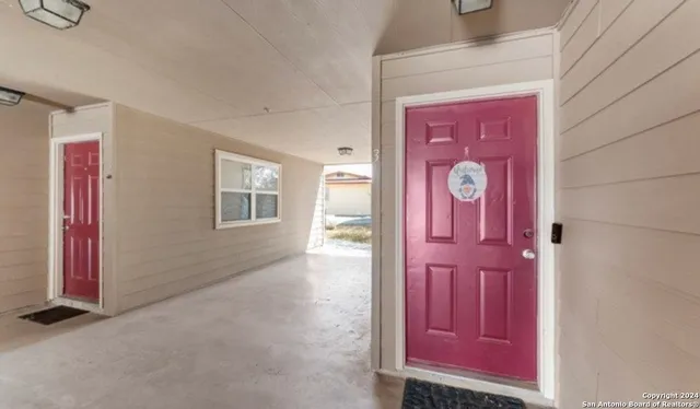 a bathroom with a sink toilet and a mirror