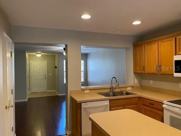 a kitchen with a sink and a refrigerator