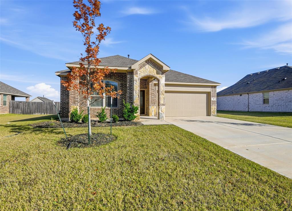 216 Post Oak Street Azle, TX 76020 - Photo 11 of 39 a view of a house with a yard and potted plants