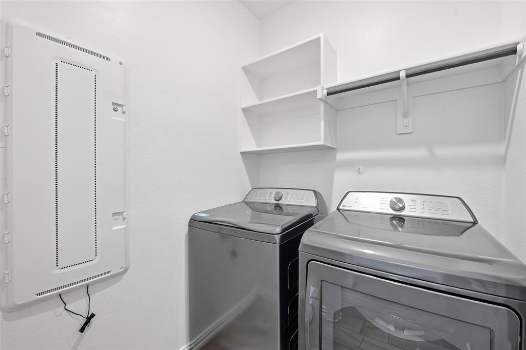 216 Post Oak Street Azle, TX 76020 - Photo 16 of 39 a utility room with dryer and washer