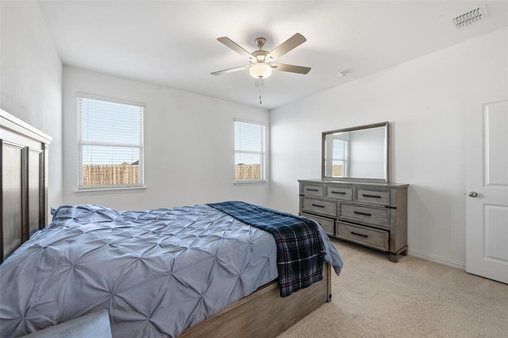 216 Post Oak Street Azle, TX 76020 - Photo 20 of 39 a bedroom with a bed and window