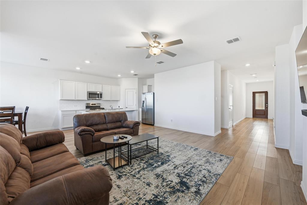 216 Post Oak Street Azle, TX 76020 - Photo 2 of 39 Living room with light wood-style flooring, recessed lighting, and ceiling fan