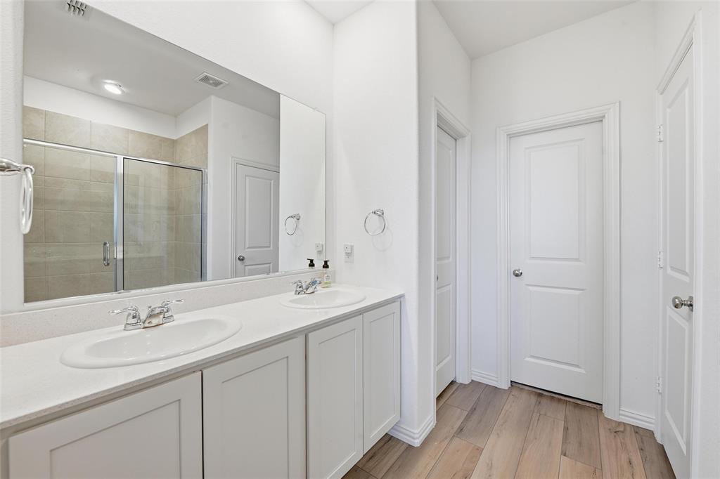 216 Post Oak Street Azle, TX 76020 - Photo 22 of 39 a bathroom with a sink shower and a mirror