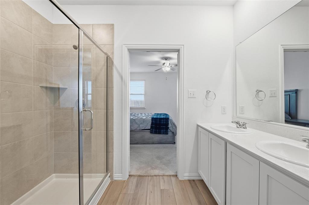 216 Post Oak Street Azle, TX 76020 - Photo 24 of 39 a bathroom with a sink and a mirror