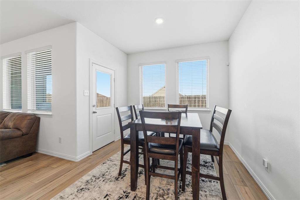 216 Post Oak Street Azle, TX 76020 - Photo 27 of 39 a view of a dining room with furniture and window
