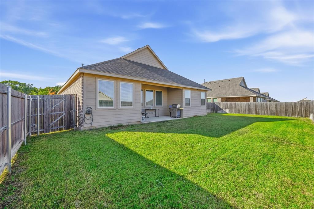 216 Post Oak Street Azle, TX 76020 - Photo 35 of 39 a front view of a house with yard and green space