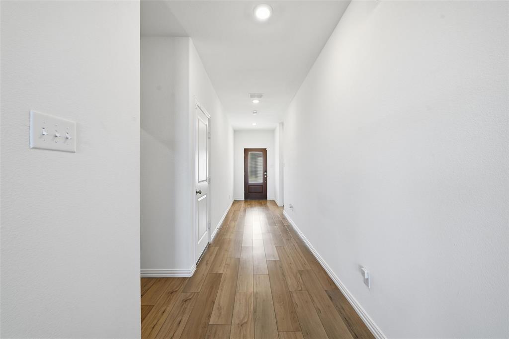 216 Post Oak Street Azle, TX 76020 - Photo 5 of 39 Corridor featuring light wood-style floors and recessed lighting
