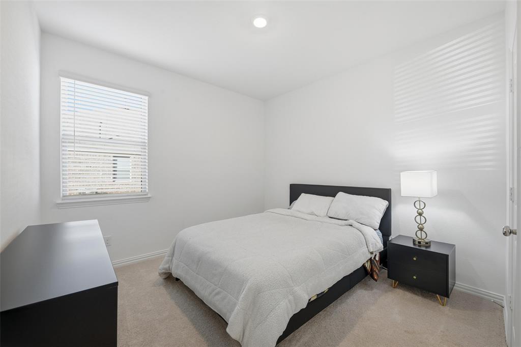 216 Post Oak Street Azle, TX 76020 - Photo 10 of 39 a bedroom with a bed and a window