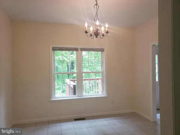 a view of a chandelier and window in a room