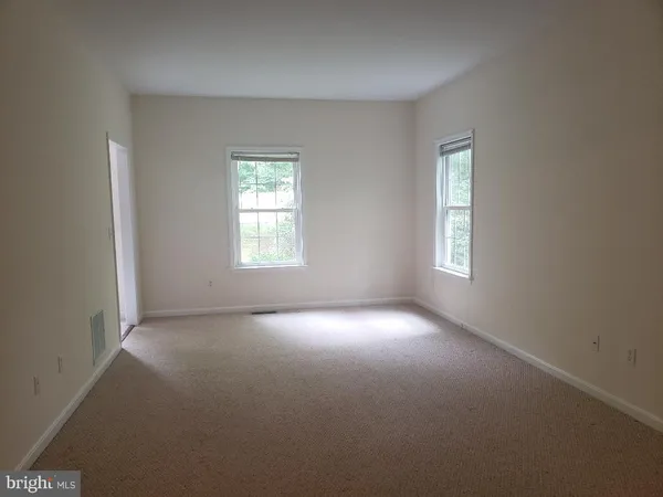an empty room that has a window