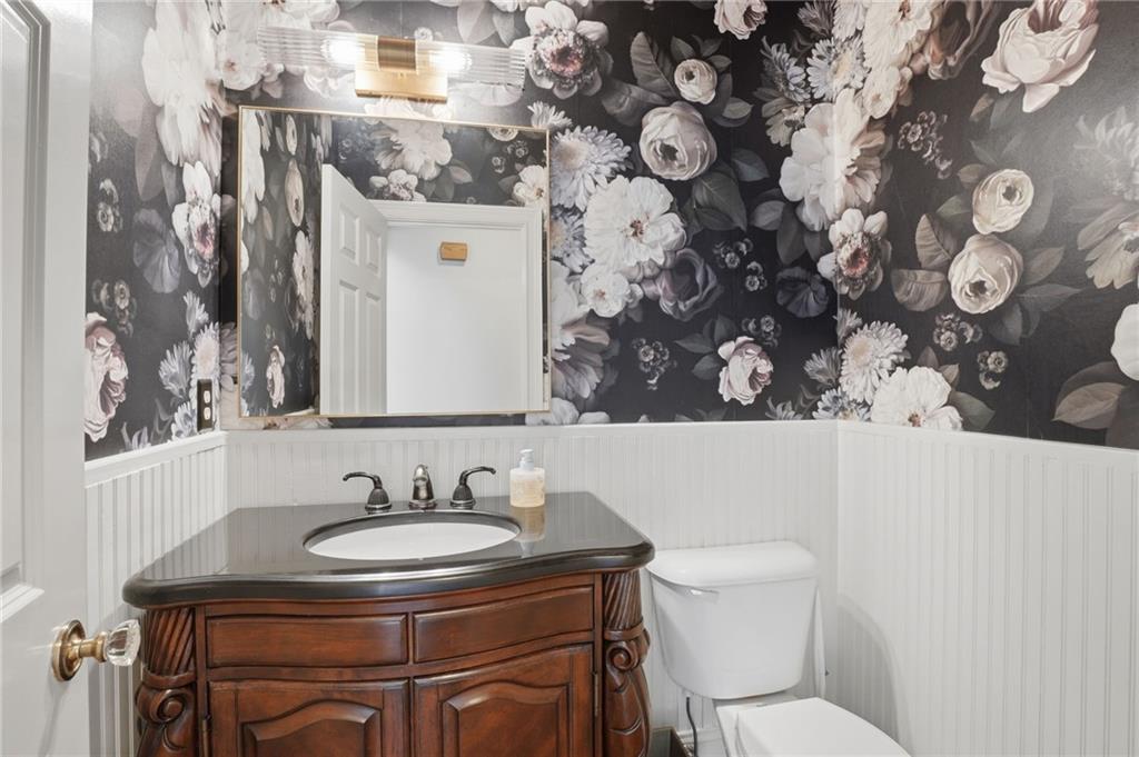 2950 Callie Still Road Lawrenceville, GA 30045 - Photo 29 of 77 a bathroom with a sink and a toilet