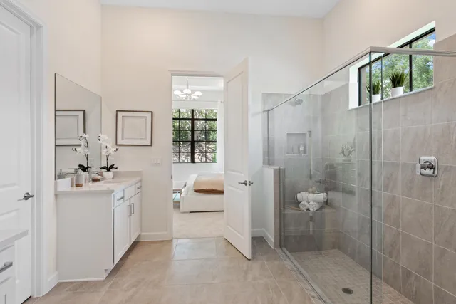 a spacious bathroom with a double vanity sink mirror and