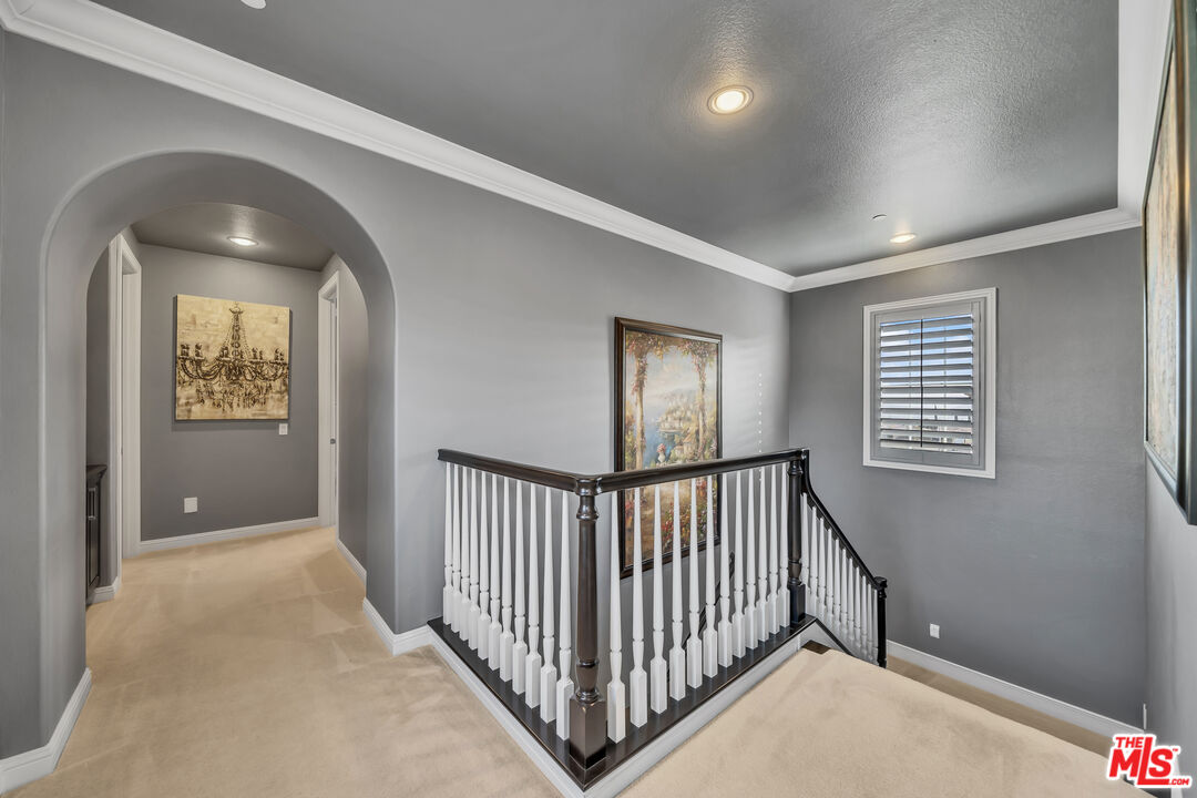 7313 Rocky Top Circle Moorpark, CA 93021 - Photo 12 of 33 a view of a hallway with windows and stairs