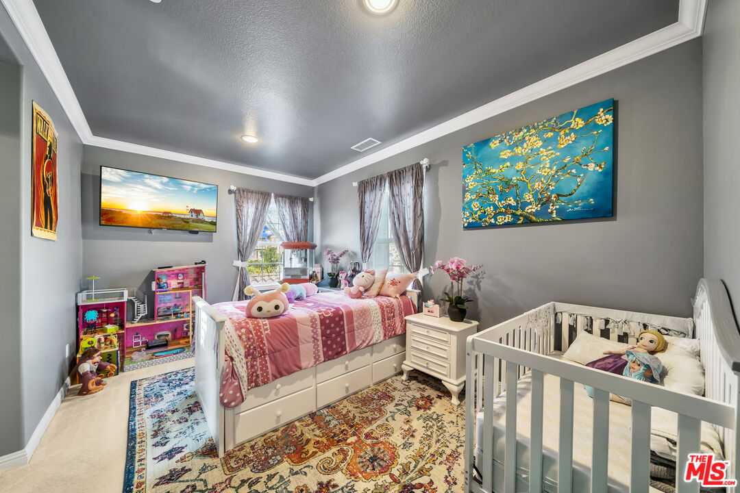 7313 Rocky Top Circle Moorpark, CA 93021 - Photo 17 of 33 a bedroom with furniture and a flat screen tv