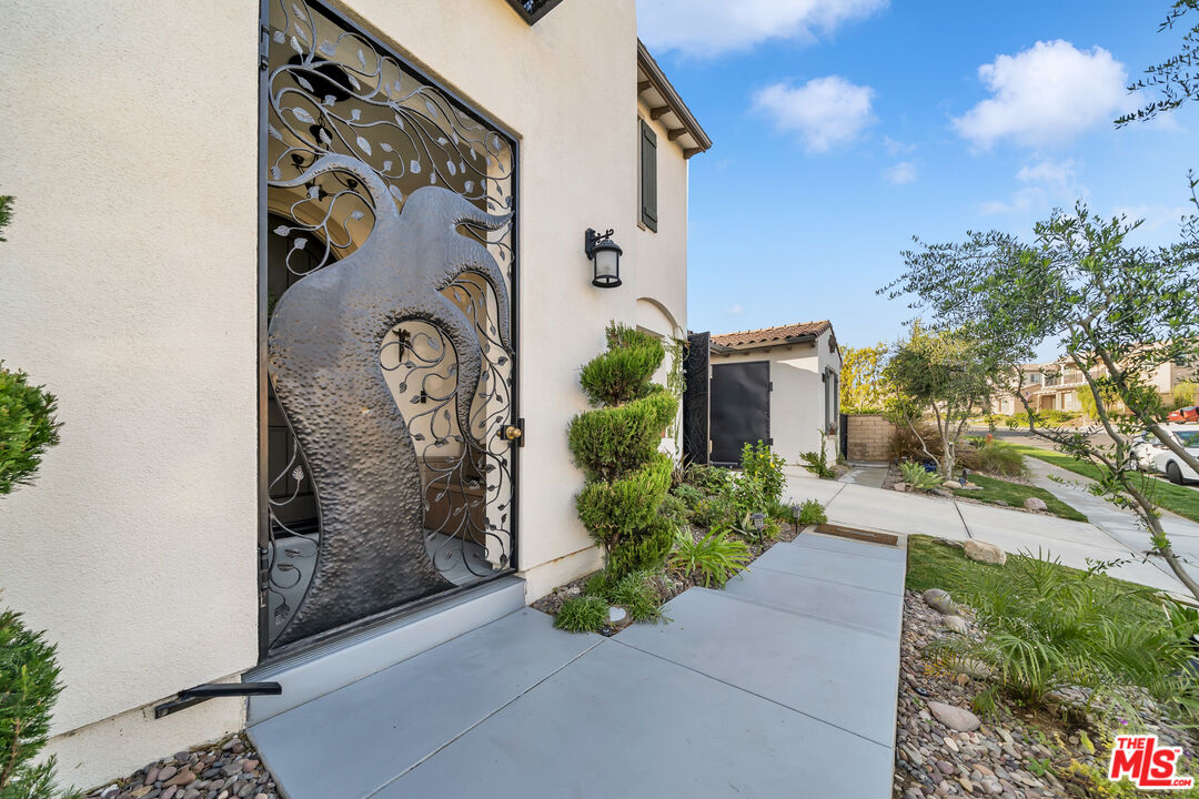 7313 Rocky Top Circle Moorpark, CA 93021 - Photo 2 of 33 a front view of a house with garden