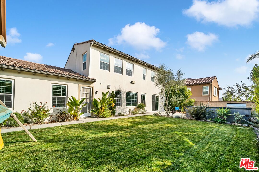 7313 Rocky Top Circle Moorpark, CA 93021 - Photo 23 of 33 a front view of a house with a yard