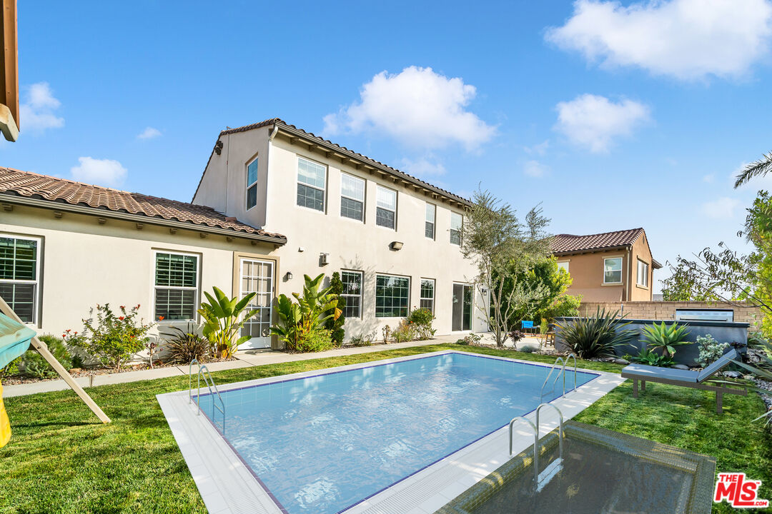 7313 Rocky Top Circle Moorpark, CA 93021 - Photo 24 of 33 a view of a house with pool plants and couches