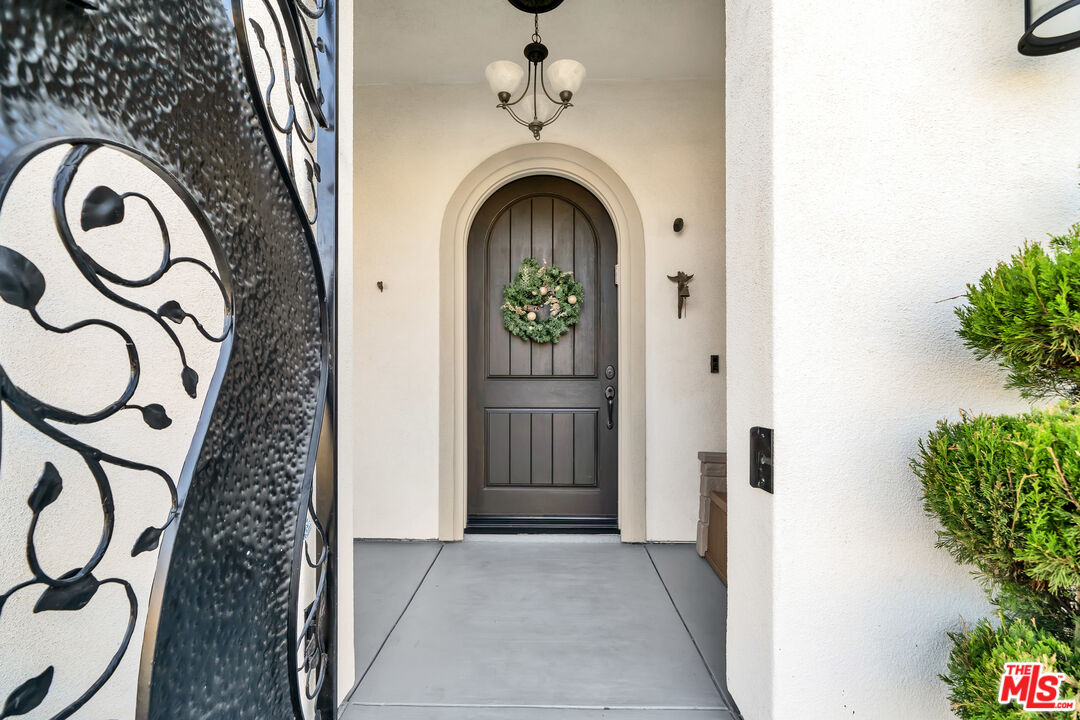 7313 Rocky Top Circle Moorpark, CA 93021 - Photo 3 of 33 a view of an entryway with a garden