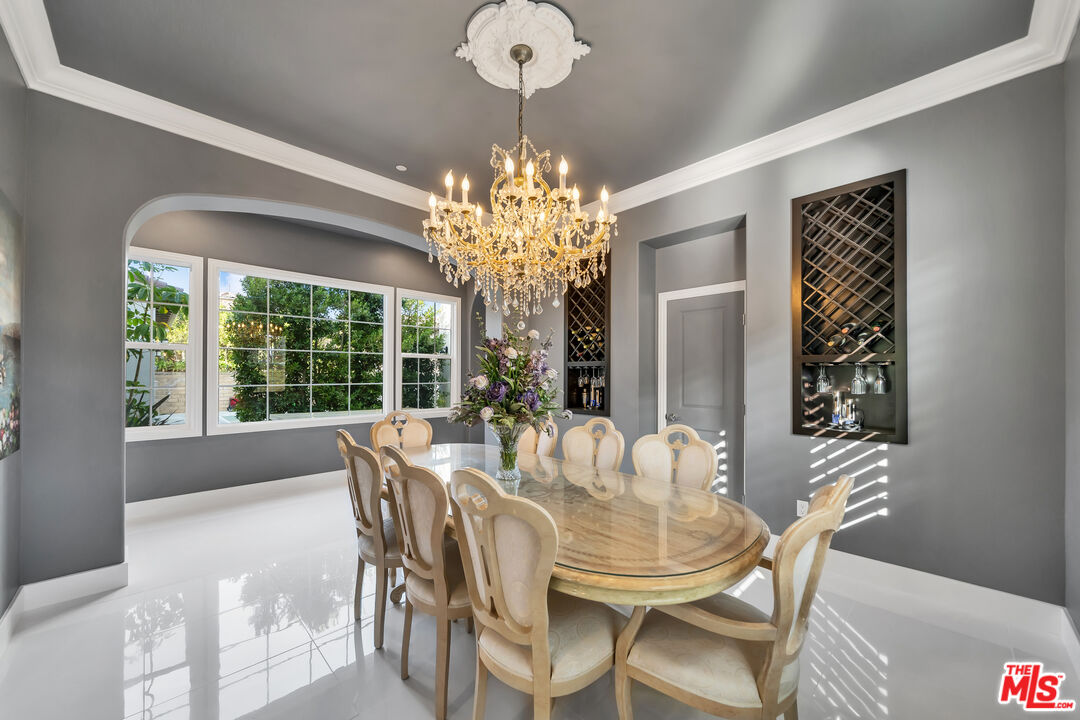 7313 Rocky Top Circle Moorpark, CA 93021 - Photo 5 of 33 a dining room with furniture a chandelier and window
