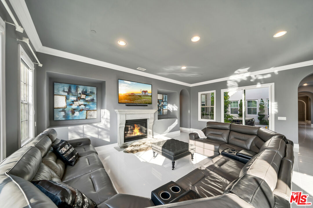 7313 Rocky Top Circle Moorpark, CA 93021 - Photo 6 of 33 a living room with furniture and a fireplace