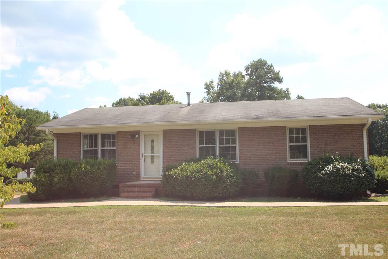 510 Fontaine Road Roxboro, NC 27574 - Photo 1 of 10 a front view of a house with garden