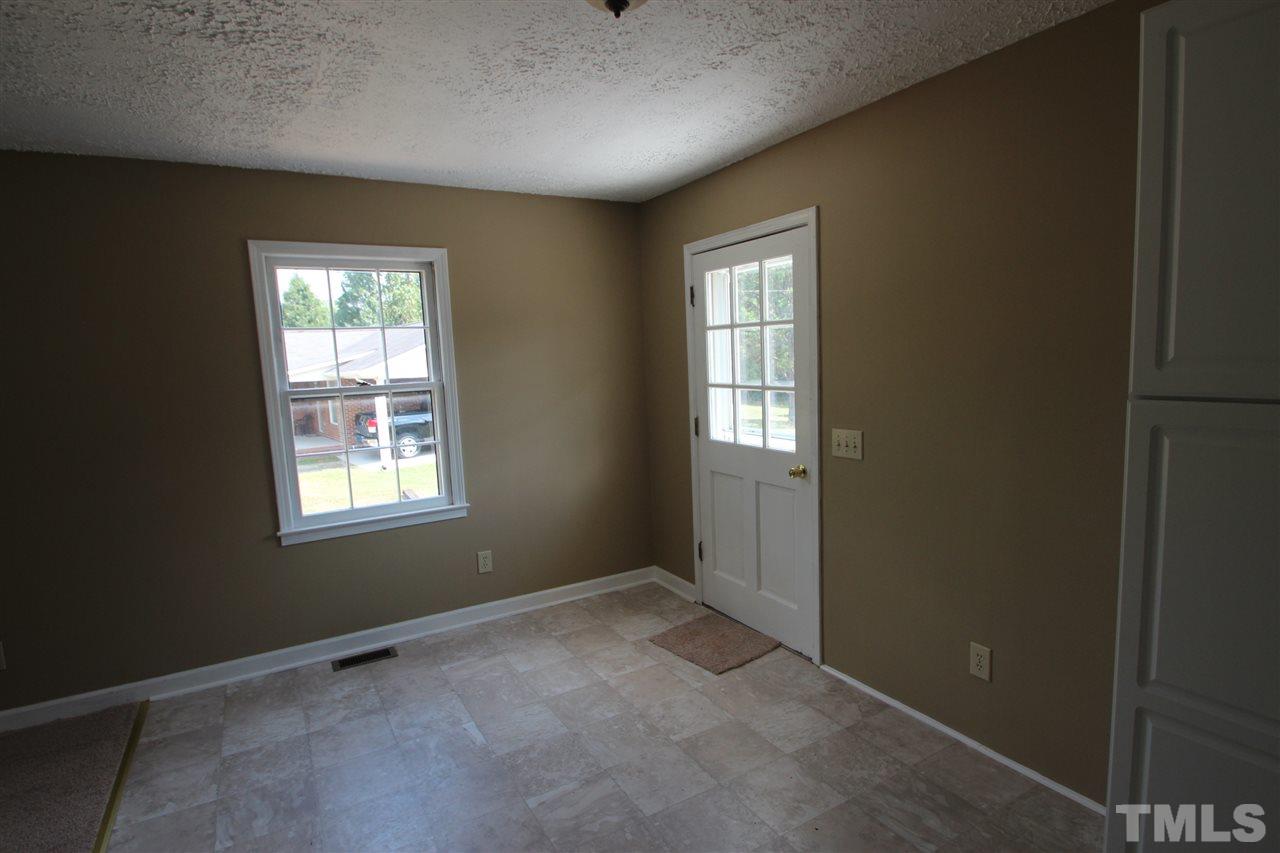 510 Fontaine Road Roxboro, NC 27574 - Photo 4 of 10 an empty room with windows