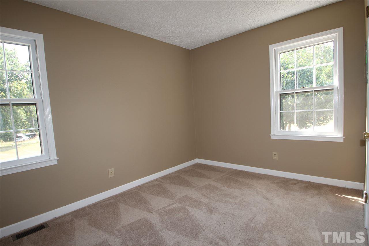 510 Fontaine Road Roxboro, NC 27574 - Photo 7 of 10 an empty room with a window